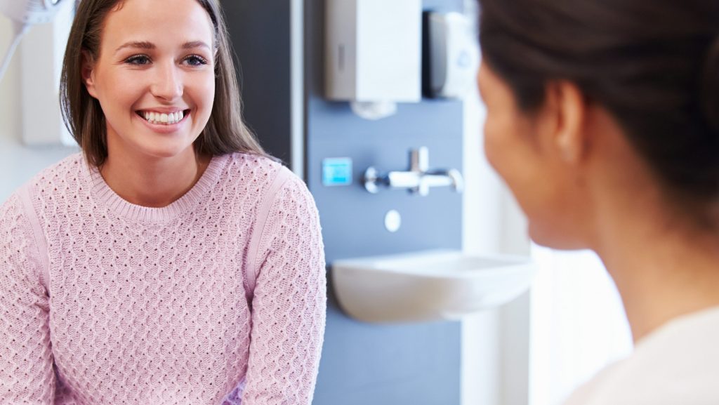 A woman in a Melbourne clinic discussion options with cosmetic surgery.