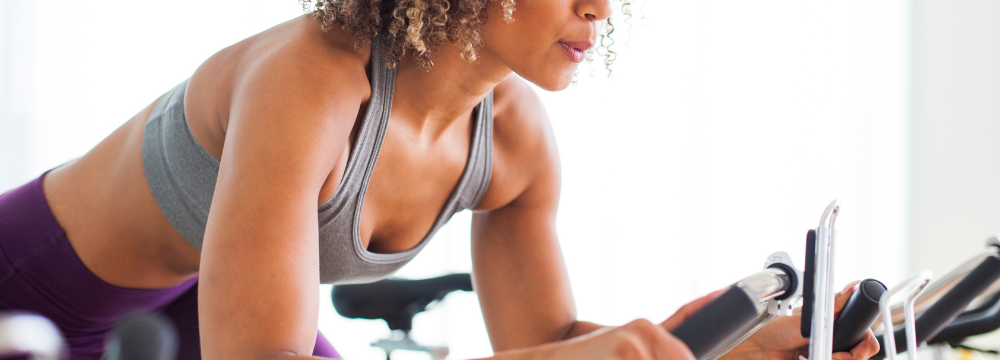 Woman exercising with Breast Implants