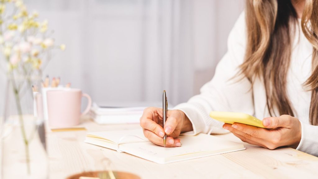 Woman looking at Images of Face Surgery Australia or Plastic Surgery on the face which includes Facelift, Rhinoplasty or Nose Job Before and After photos, Eyelid Lift, Ear pinning (or Otoplasty), Neck Lift