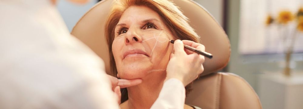 Mature woman with Plastic Surgeon at Facelift consultation in Australia